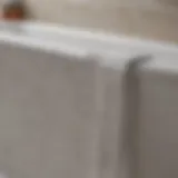 Close-up view of caulk bathroom tape application on a bathtub edge