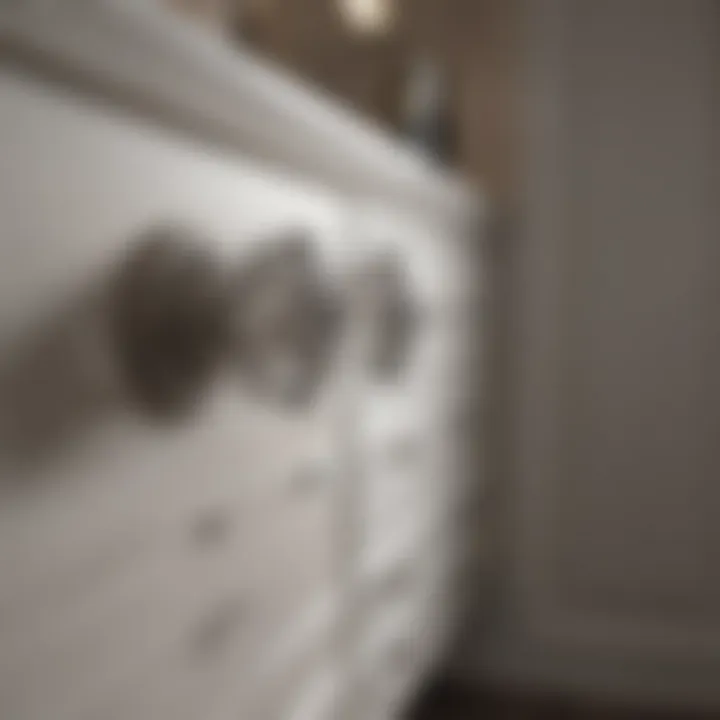 Installation of crystal knobs on a modern bathroom cabinet