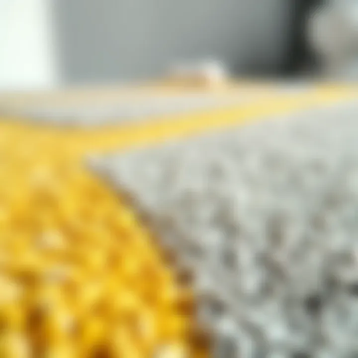 Close-up of textured yellow and grey rug fabric