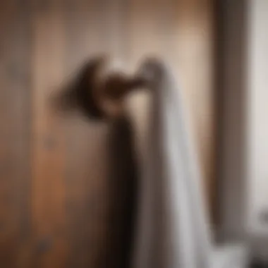 Rustic wooden towel hook mounted on a bathroom wall