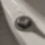 Clogged bathtub drain showcasing hair and debris buildup